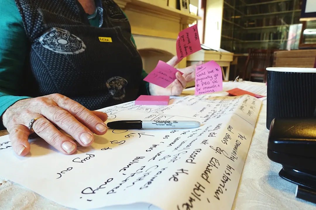 A women with a collection of postit notes and handwritten posters