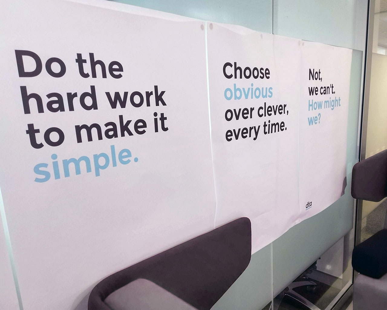 A set of posters found on the walls at the Digital Transformation Agency that say do the hard work to make it simple and choose obvious over clever every time.