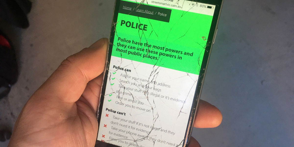 A photo of a phone with a cracked screen with the Street Smart website loaded up on it. The page details your rights when it comes to engaging with the Police.