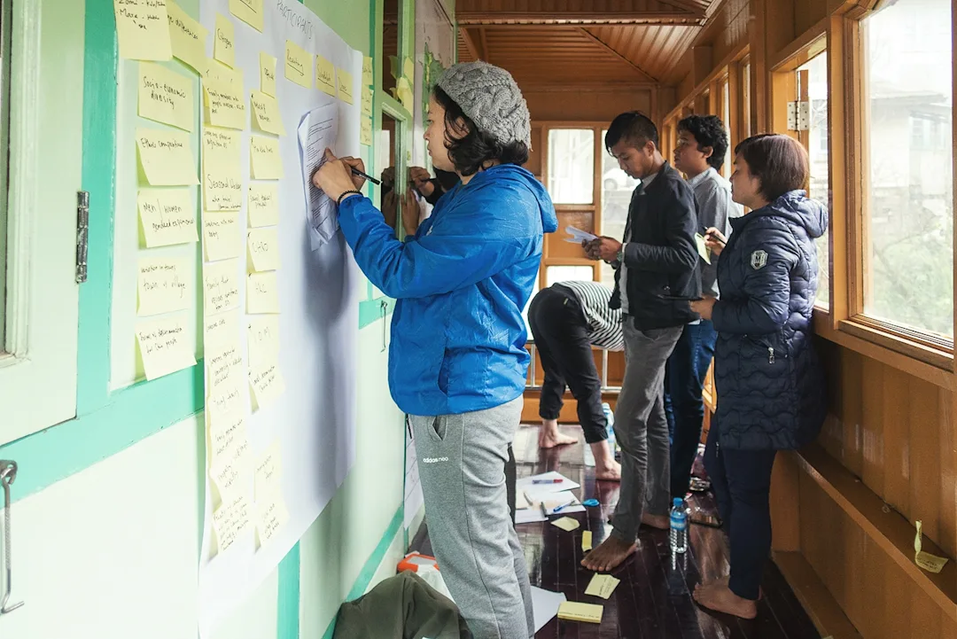 Researchers plotting data on postit notes in Myanmar