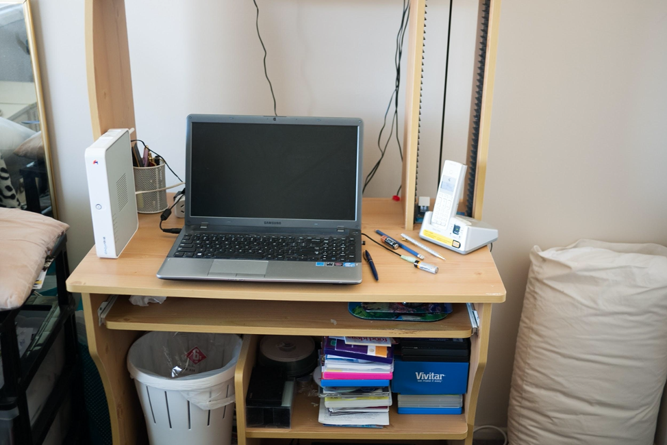 A home computer setup with internet and a cordless phone.
