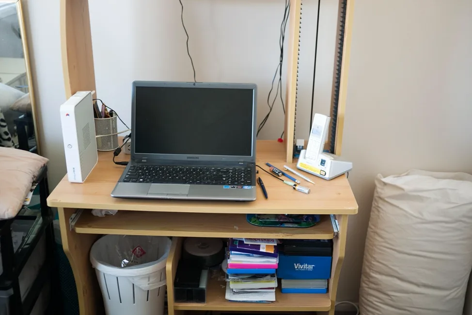 A home computer setup with internet and a cordless phone.