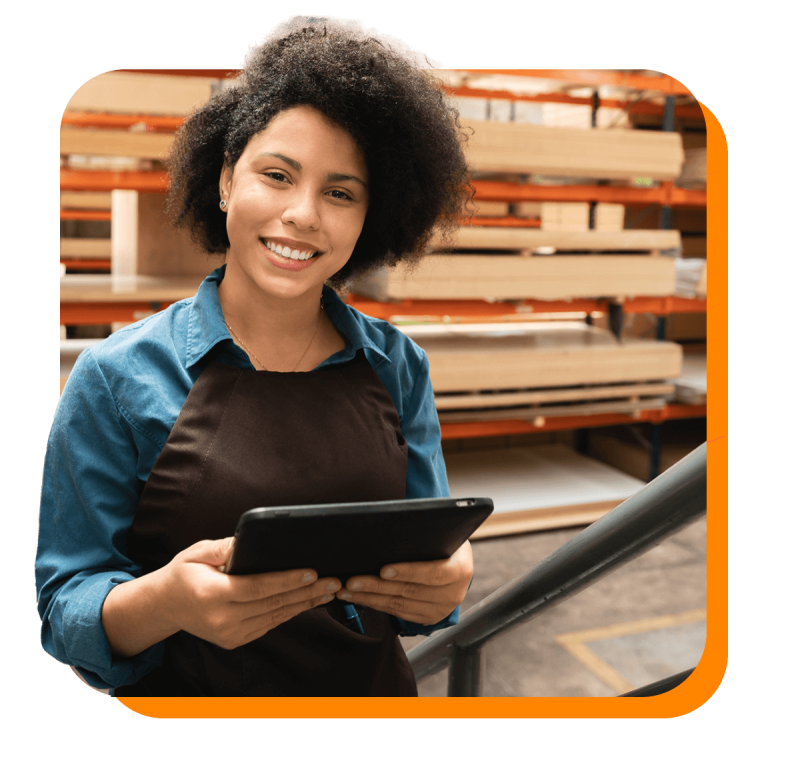 happy female worker with tablet at warehouse