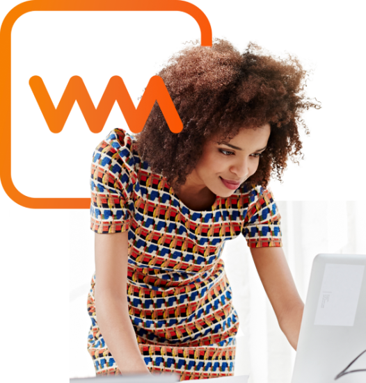 Woman in colorful dress looking down at computer with WorkMarket logo
