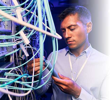 IT worker fixing a control board