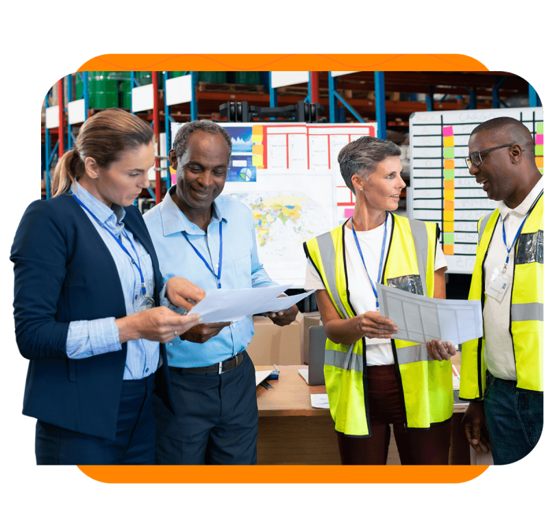 A group of workers reviewing documents together