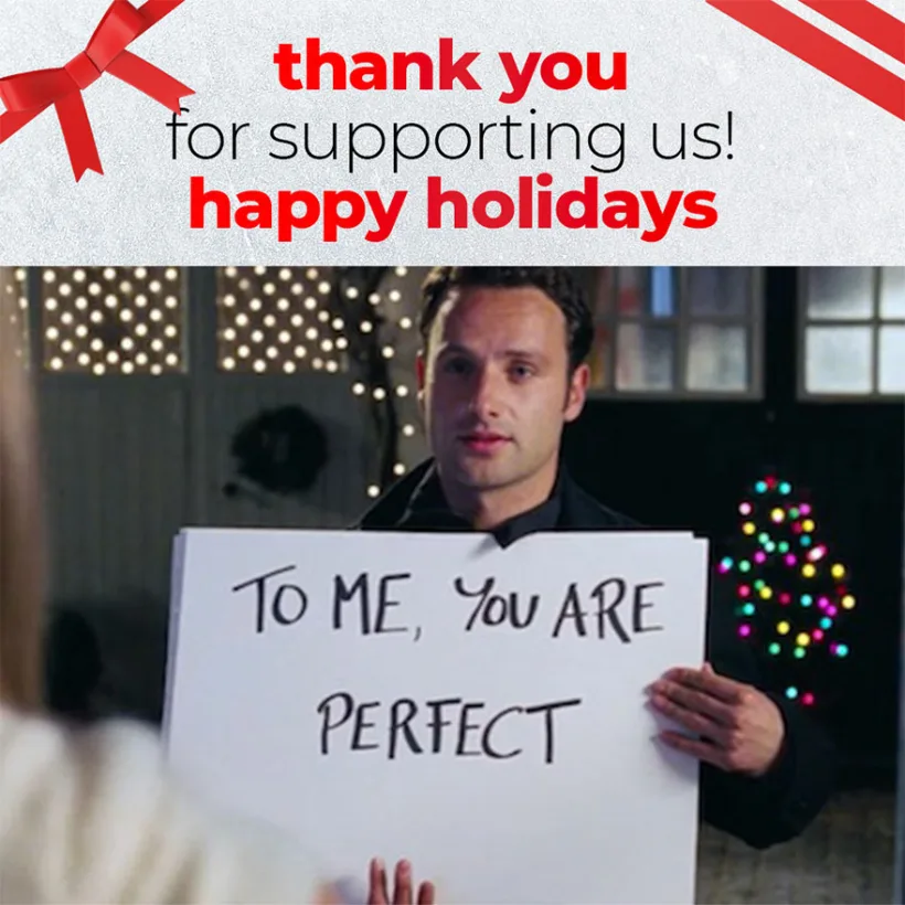 Love actually scene with sign showing 'To me you are perfect'