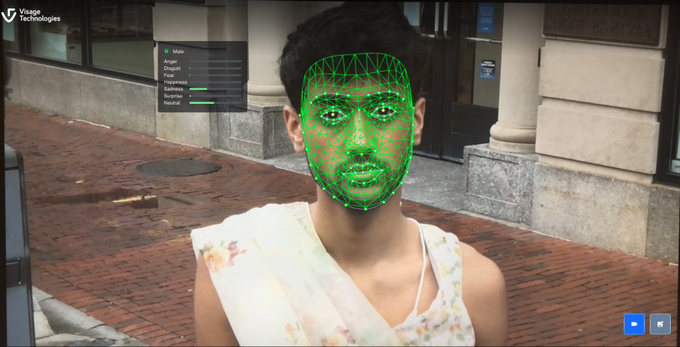 Visage Technologies in left top corner, shows image of a person's face being scanned with green facial recognition technology. 