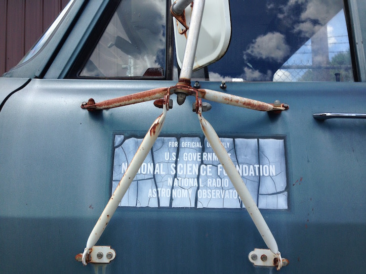 Side of a truck with a plaque that reads "US Government National Science Foundation National Radio Astronomy Observatory"