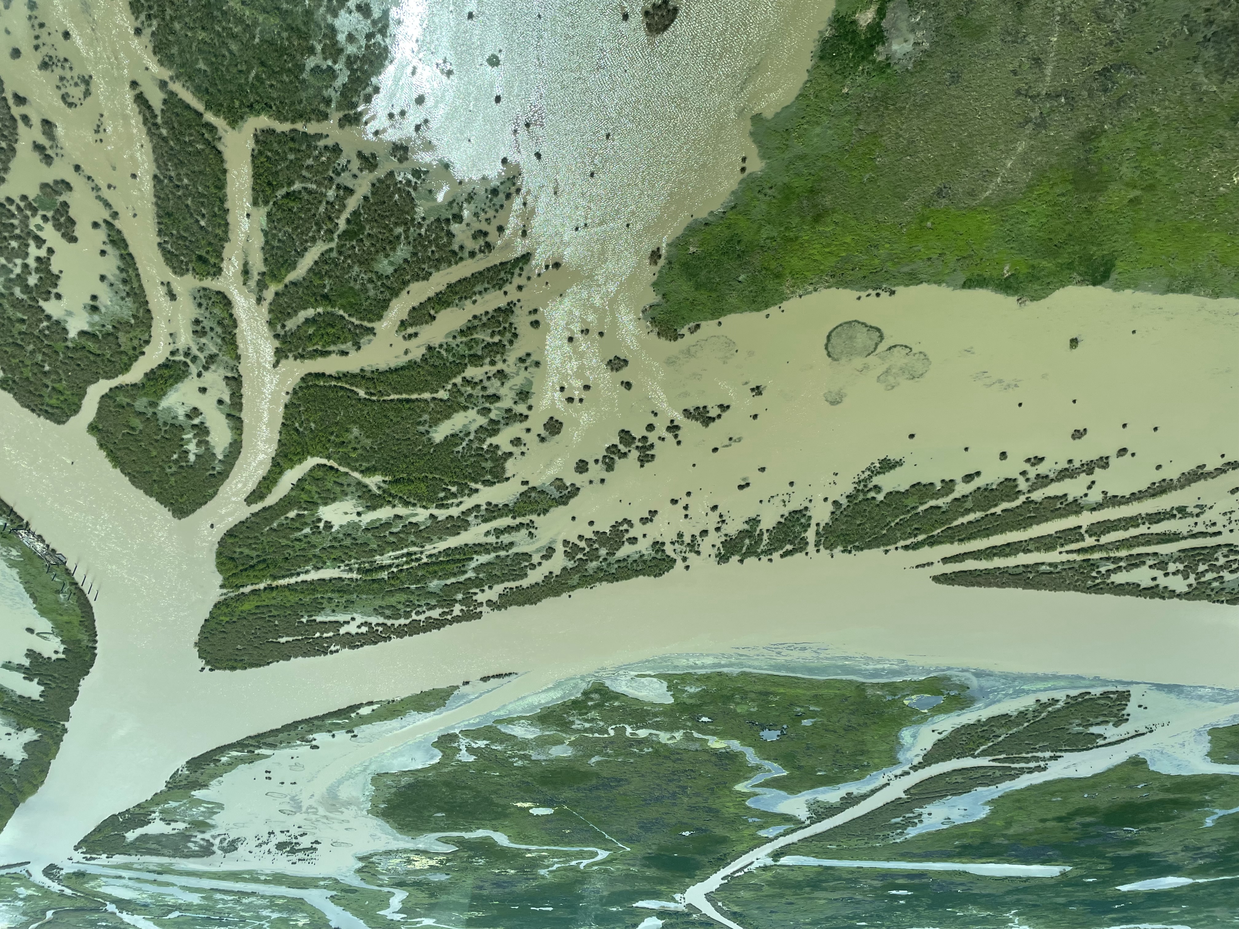From high above the Louisiana shoreline, the state’s coastal erosion crisis is evident, with more than 2,000 square miles disappearing into the sea over the past century. Photo: Xander Peters, 2023. 	