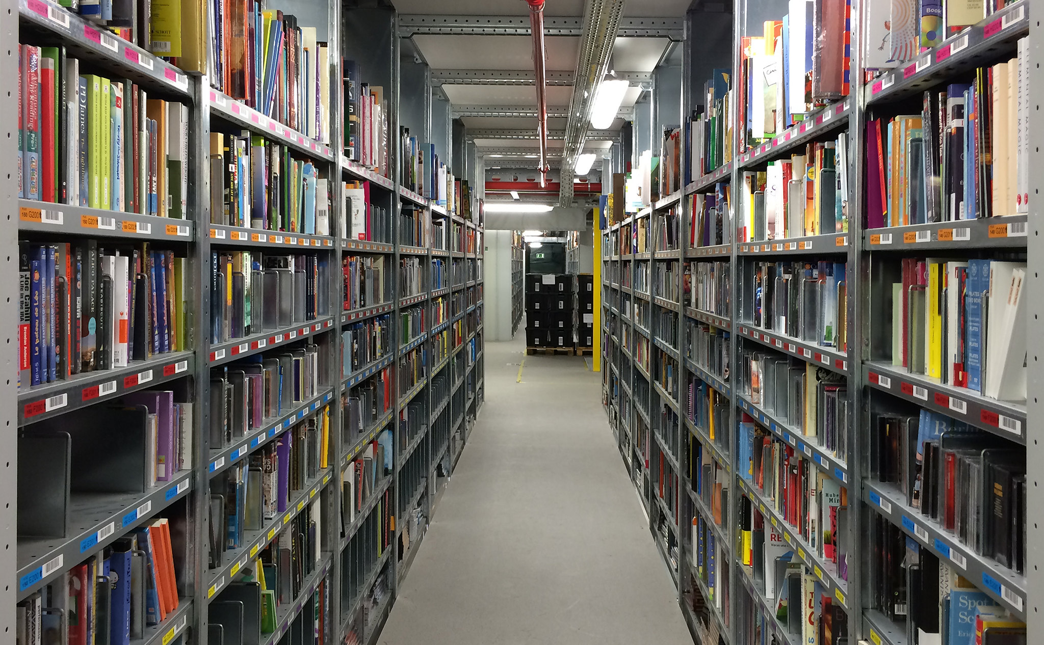 Shelves lined with barcodes in an Amazon fulfilment centre. Photo: Alvaro Ibanez, CC BY 2.0 via Flickr.	