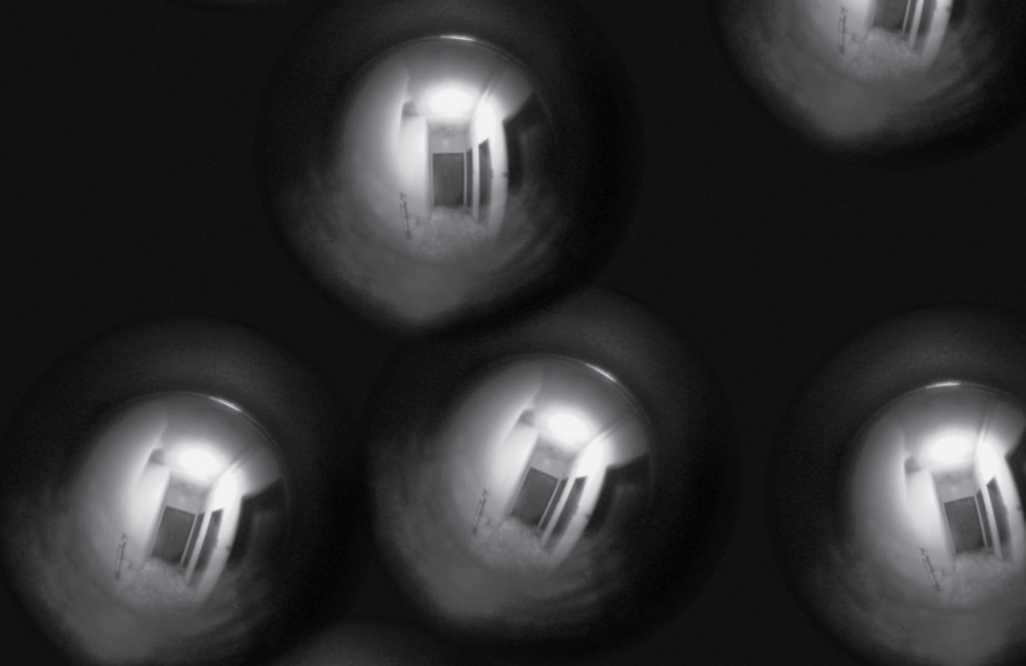 Floating hazy peephole images looking into what appears to be a hallway