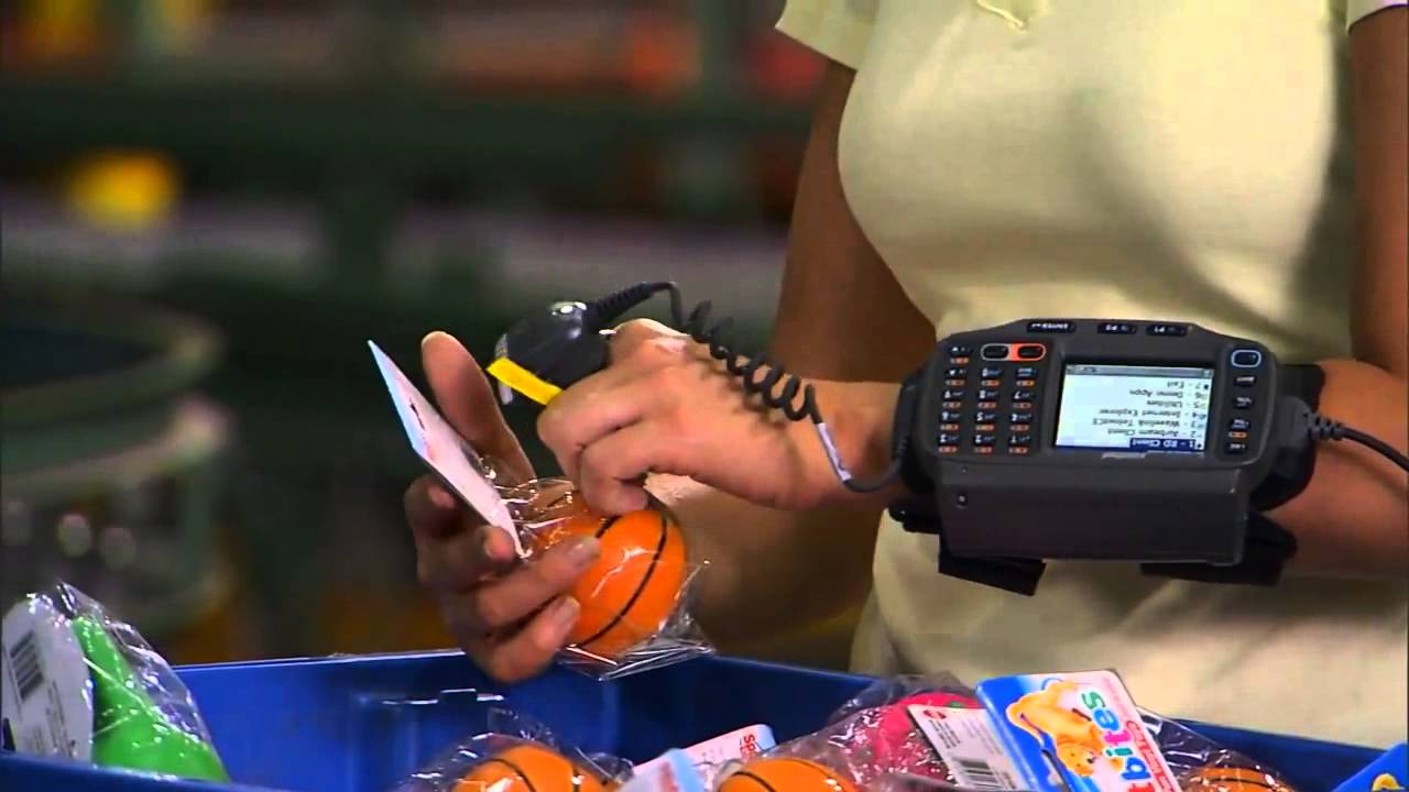 A logistics worker wearing a Motorola WT4000 with ring scanner.	 Image: Barcode, Inc.