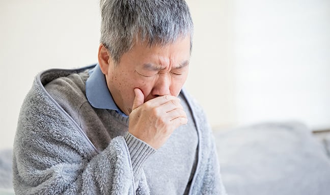 Older person coughing