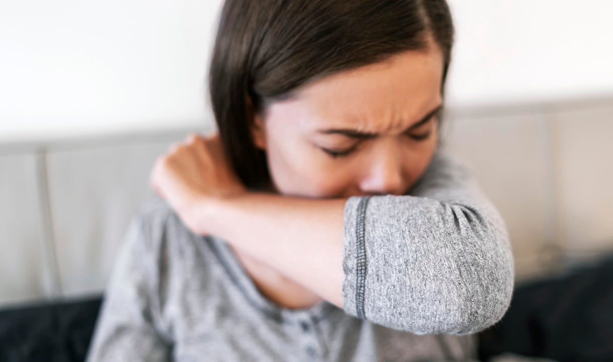 Person smelling her breath