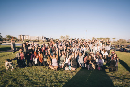 Phoenix Babes Who Walk participants cheering for a group photo at a Waymo-sponsored morning walk