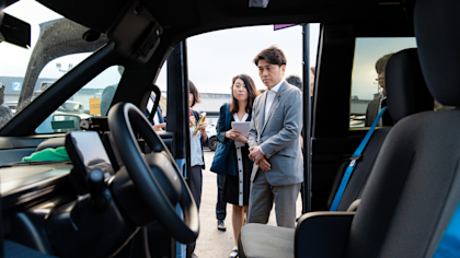 Minister Nakano looking at Waymo's next vehicle platform, the Zeekr RT 