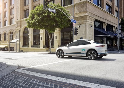 A rendering of a white, I-PACE with the 4th-gen Waymo Drivr
