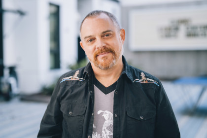 Portrait of Alex Ray, the LGBTQ+ program coordinator at Curry and the facilitator of Lunch Bunch