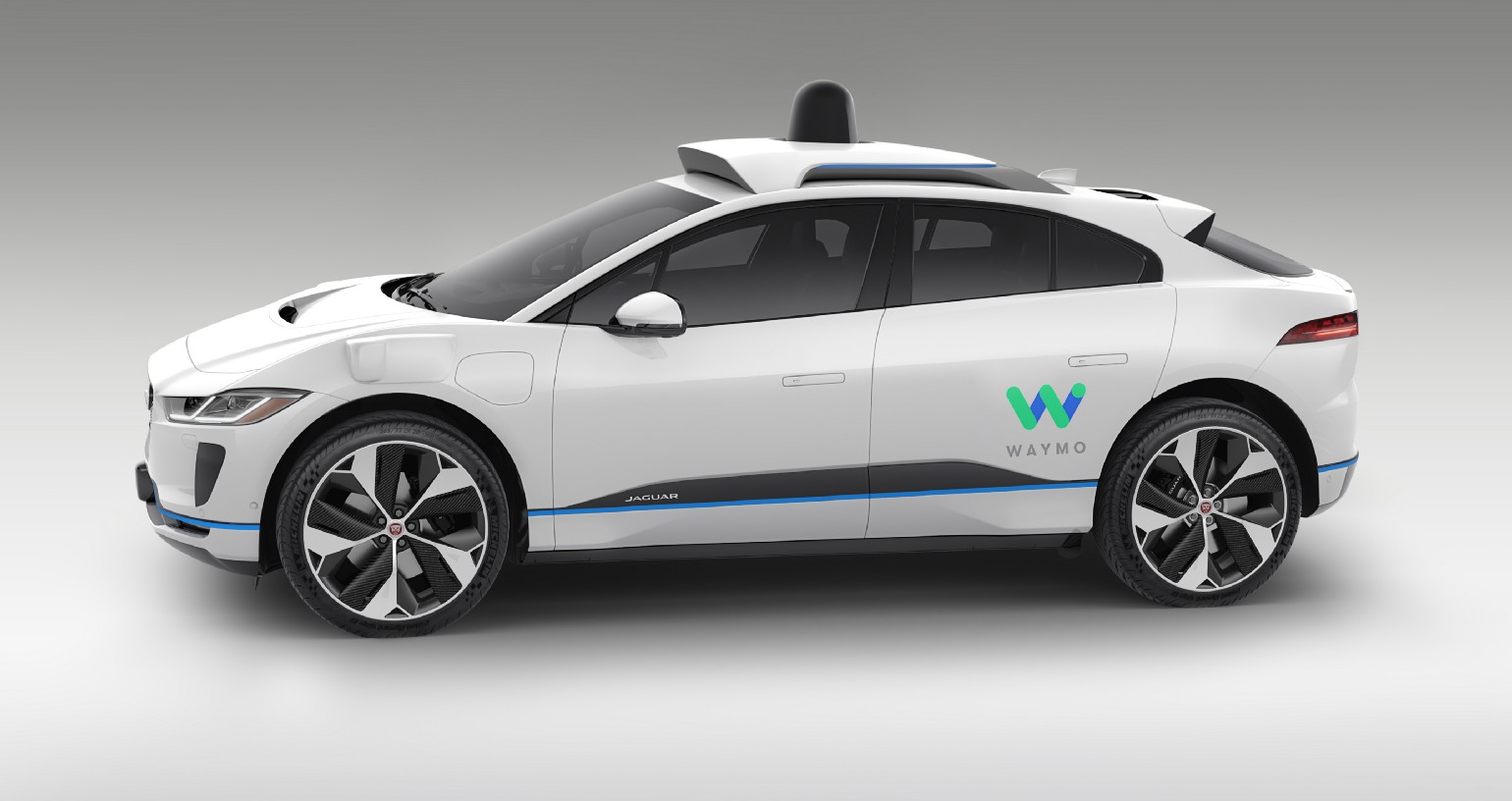 A rendering of a white, I-PACE with the 4th-generation Waymo Driver