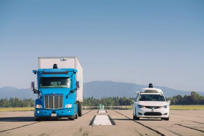 A photo of a blue, Waymo Via truck and white, Waymo One van with the 4th-gen Waymo Driver
