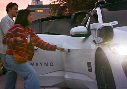 Riders entering Waymo car