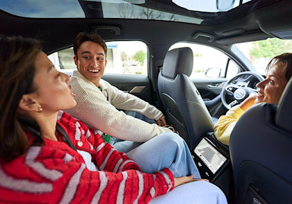 Riders laughing in back of Waymo car