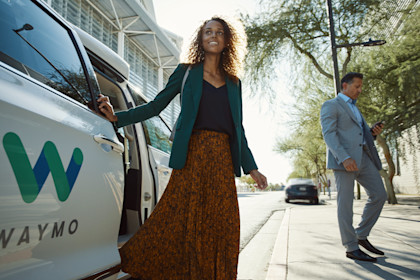 Female next to Waymo