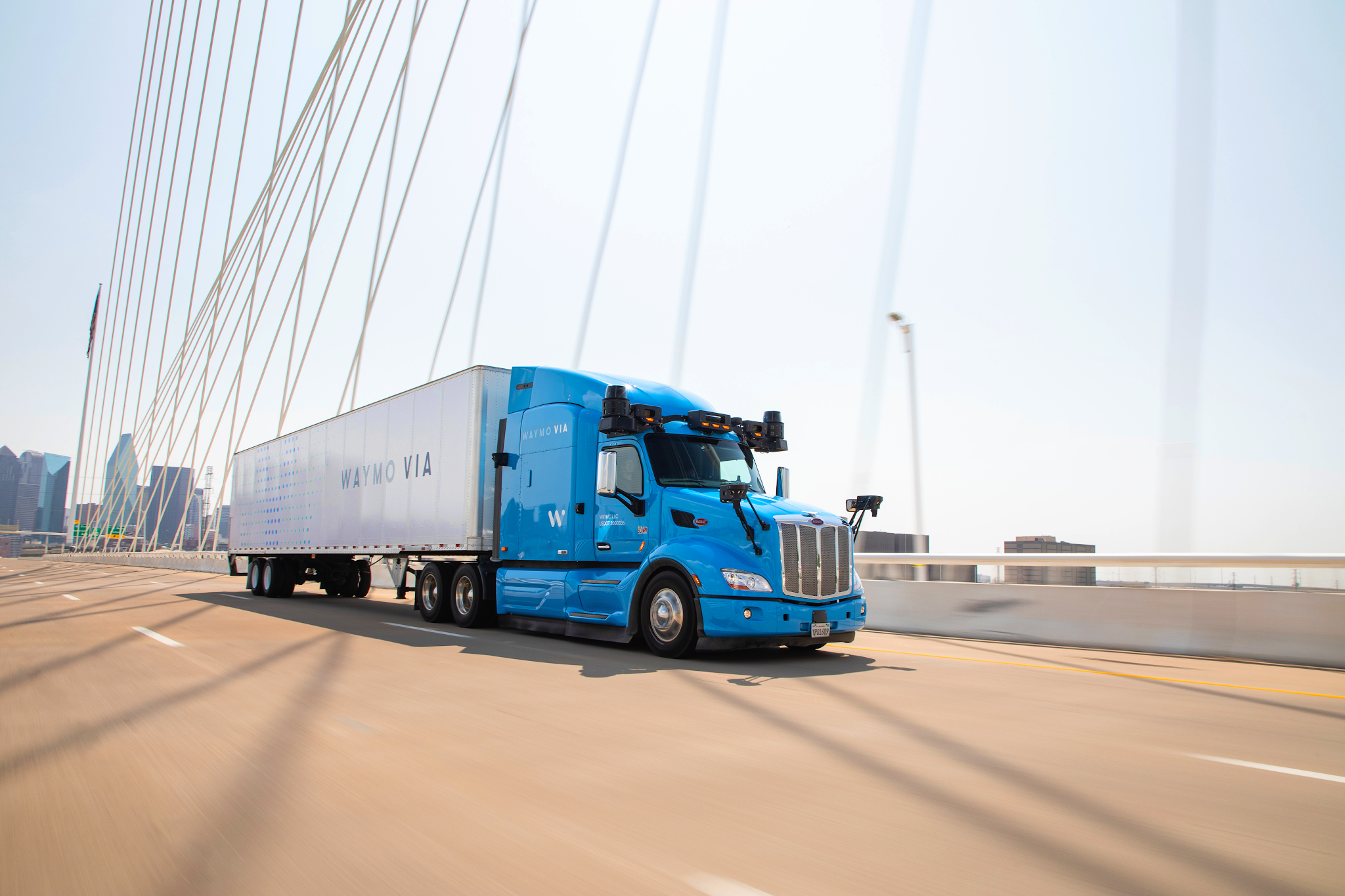 Waymo Via truck driving on bridge