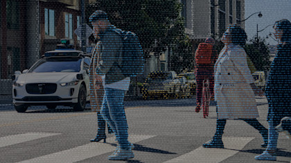 Waymo vehicle waiting at intersection