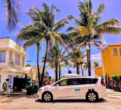 A white, Waymo Pacifica minivan in Miami