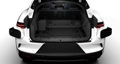 A gif of the trunk of a Waymo One I-PACE with various objects in it, including a wheelchair, golf-clubs, and luggage