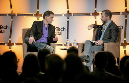 A photo of Dmitri Dolgov on the stage at EmTech Digital conference 