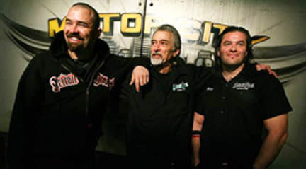 Motor City Motors Cast Members in Automotive Workshop