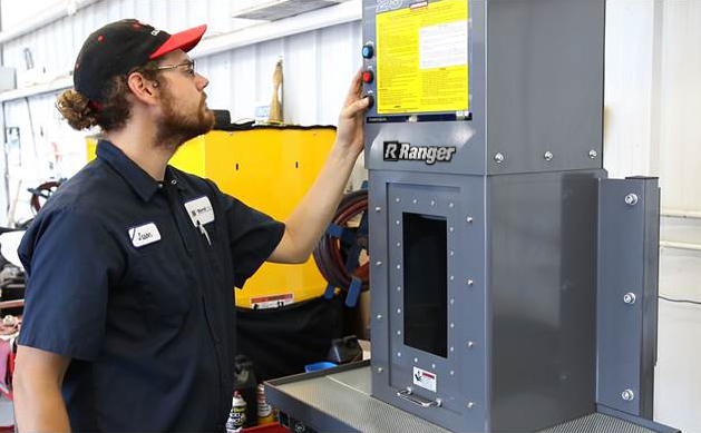 Ranger Oil Filter Crusher Machine In Use at Automotive Shop