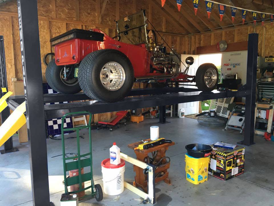 BendPak Four Post Lift With Hot Rod in Home Garage