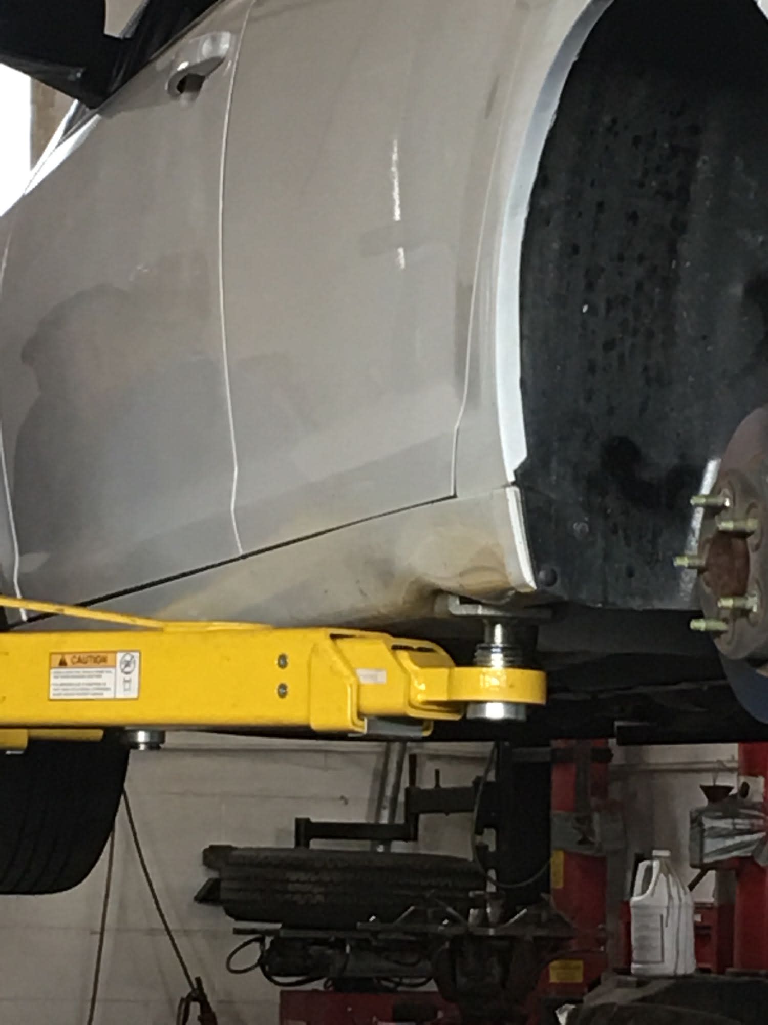 Proper Two Post Lift Arm Positioning at Factory Lift Points