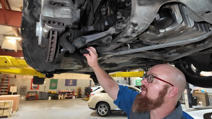 Car Wizard Suspension Inspection on BendPak Lift