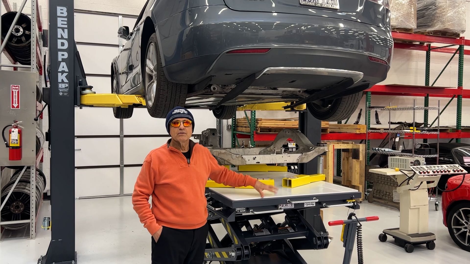 BendPak EV4000 Scissor Lift With Vehicle On Two Post Lift at Gruber Motors