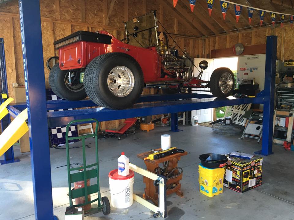 BendPak Four Post Lift With Vintage Hot Rod Garage Storage