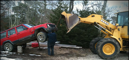 Improvised Vehicle Lift Using Loader and Wood Blocks