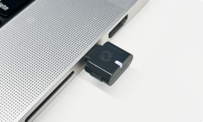 Avantree C82 Aura plugged into the USB port on a laptop
