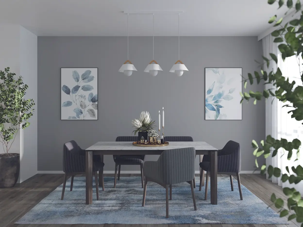 Stylowa lampa Almitara zawieszona na listwie w minimalistycznej jadalni z roślinami, grafikami i dużą ilością światła dziennego.