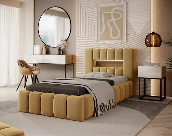 Łóżko tapicerowane Lamica 90x200 cm w tkaninie Nube 45 z pojemnikiem na pościel w jasnej, nowoczesnej sypialni. Miękki, segmentowy zagłówek, szara pościel, toaletka z okrągłym lustrem i ciepłe oświetlenie.