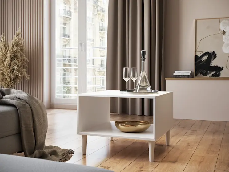 Stolik kawowy Dullum w jasnym wnętrzu salonu. Minimalistyczny design, smukłe nóżki i funkcjonalna półka pod blatem.