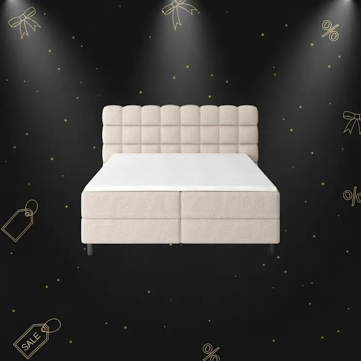 Tapicerowane łóżko Camma z pikowanym zagłówkiem, w eleganckim, beżowym odcieniu.