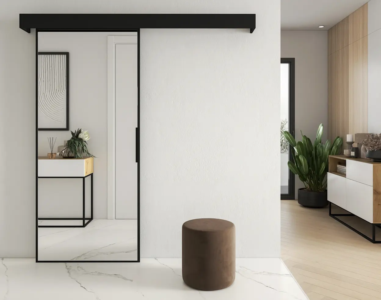 Nowoczesne drzwi przesuwne Lindo w czarnej prowadnicy, ustawione przy jasnej ścianie w minimalistycznym wnętrzu. W kadrze widać także pufę Linsy oraz przejście do salonu z komodą i rośliną w donicy.