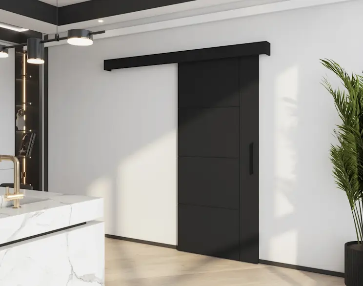 Czarne drzwi przesuwne Crestina w nowoczesnym wnętrzu z jasną podłogą, marmurową wyspą kuchenną i rośliną dodającą lekkości aranżacji.