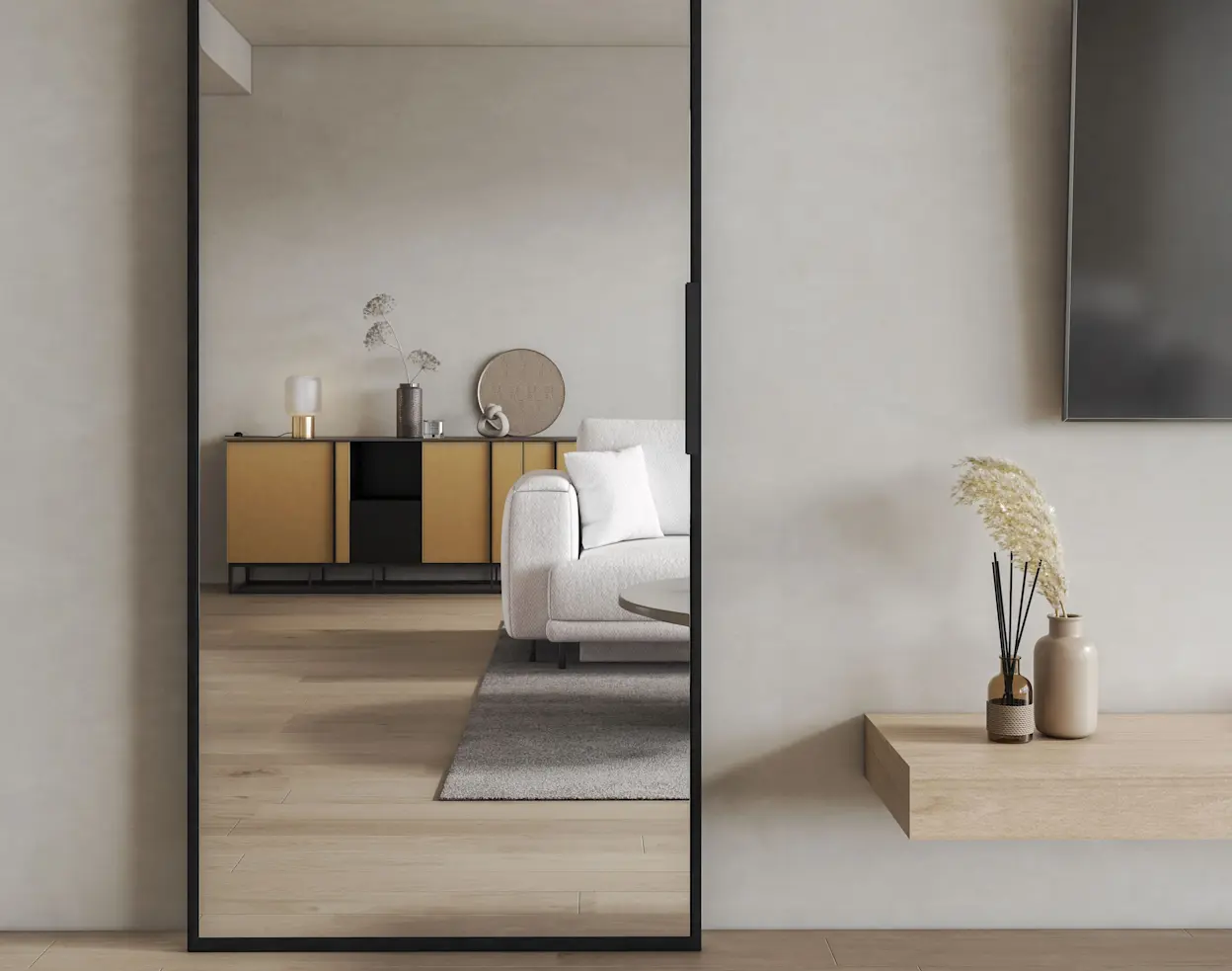 Lustrzane drzwi przesuwne Lindo w minimalistycznym salonie, odbijające jasną sofę i komodę, dodające wnętrzu lekkości i przestrzeni.