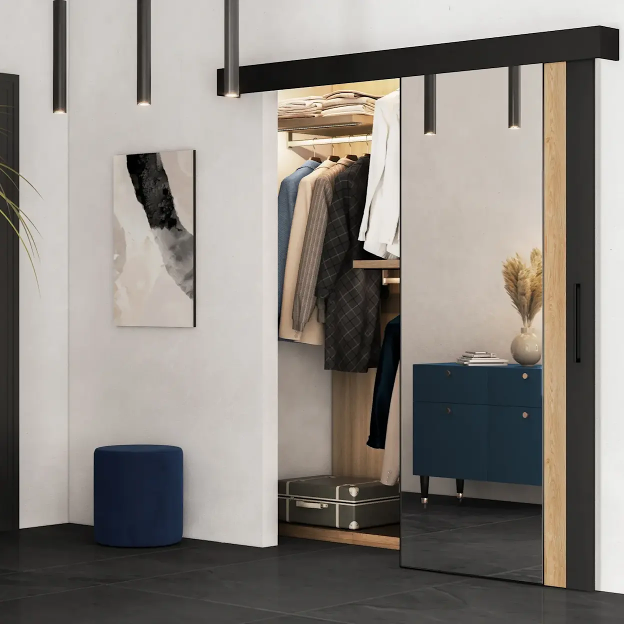 Przedpokój z drzwiami przesuwnymi Tilmann z lustrem i granatową pufą Linsy, prowadzący do garderoby w jasnym, eleganckim wykończeniu.
